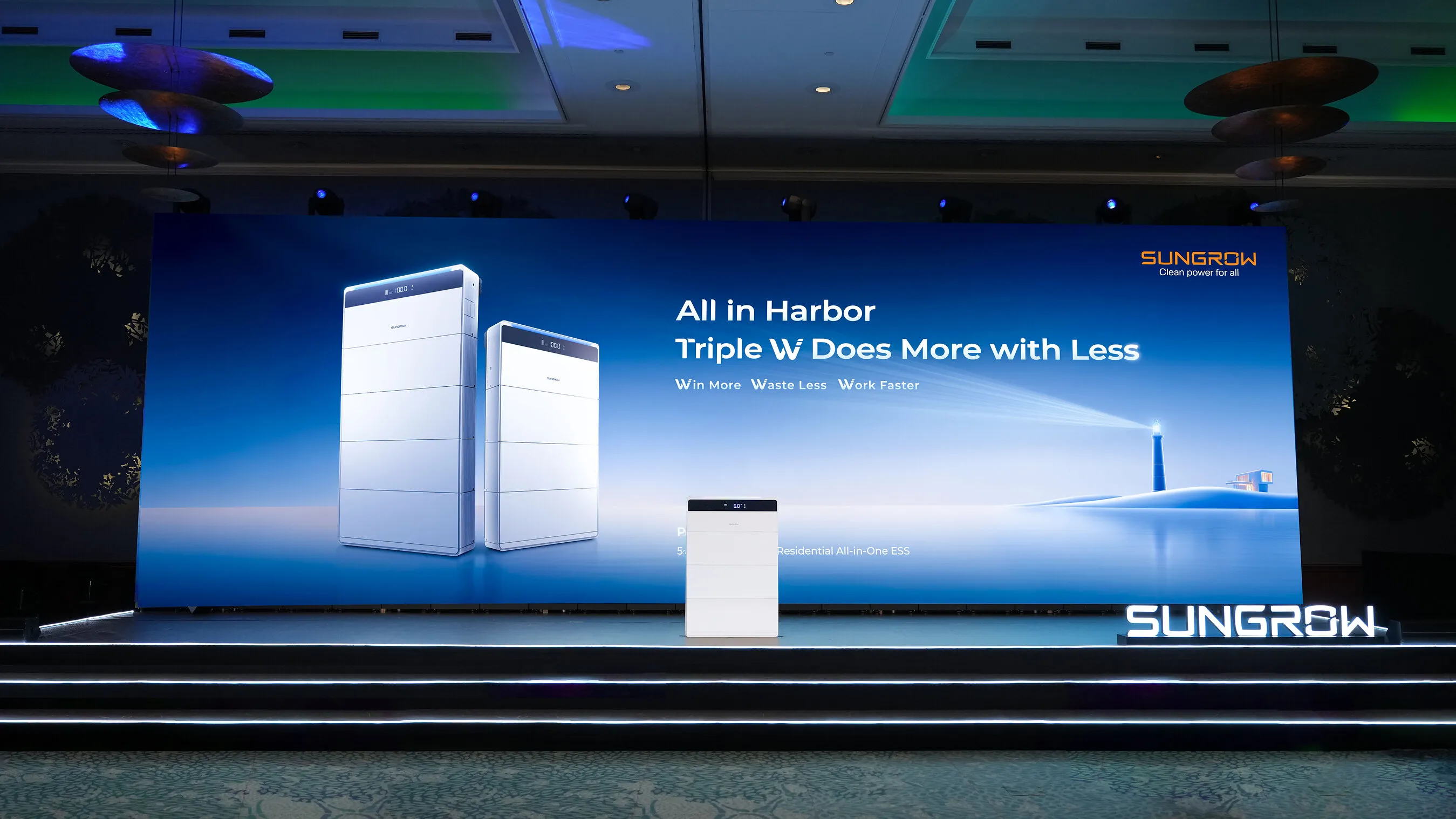 Sungrow residential energy storage unit displayed on a stage before a blue presentation screen