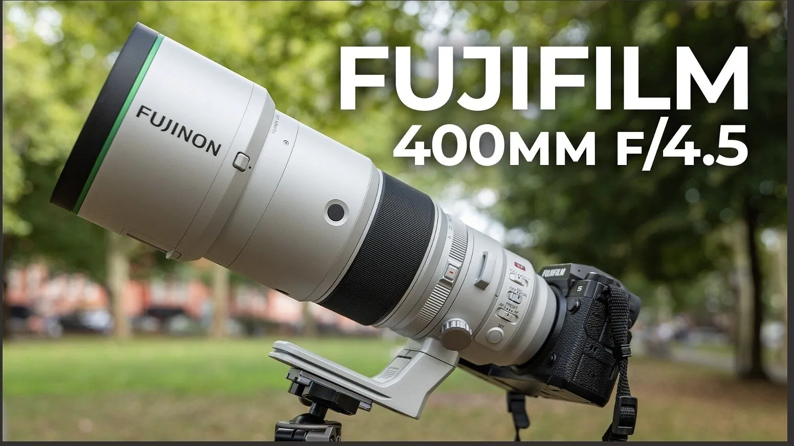 Fujifilm camera with a Fujinon 400mm f/4.5 telephoto lens on a tripod in a park