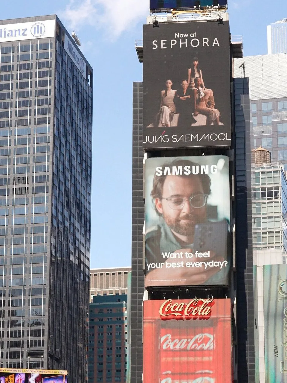 Times Square billboards for Sephora, Samsung and Coca-Cola beside an Allianz building.