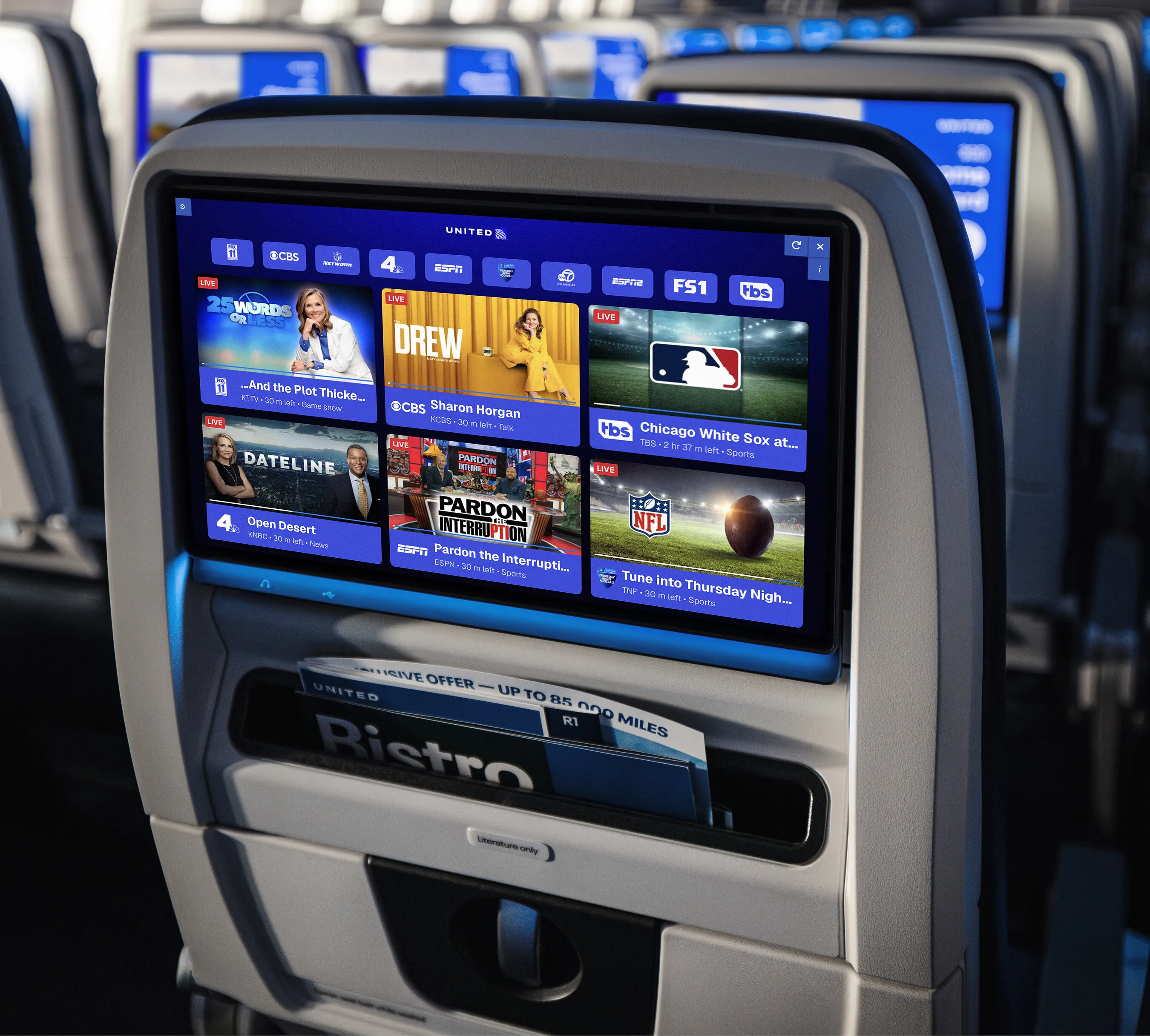United Airlines seatback screen showing live sports and TV channels.